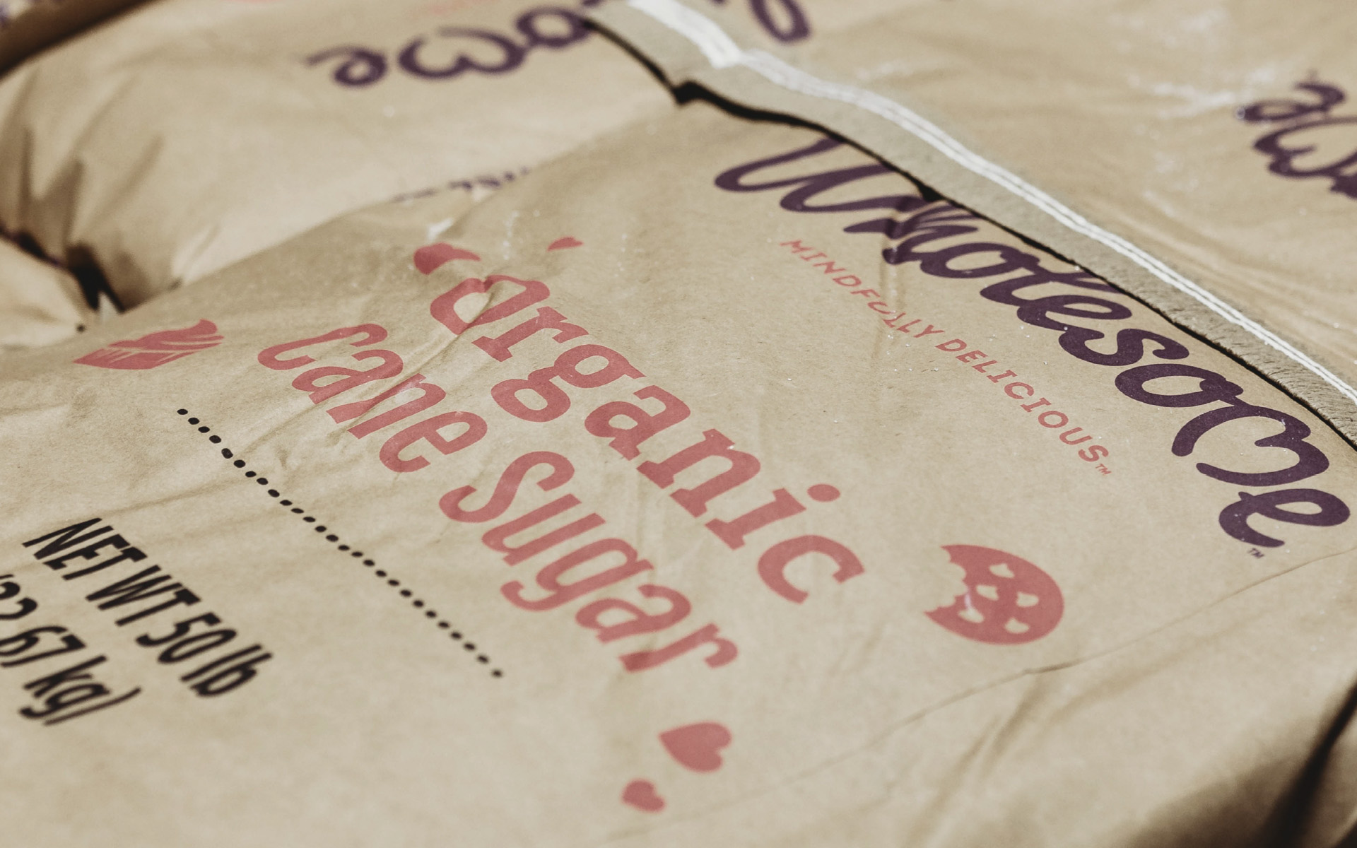 photo of large bags of organic cane sugar